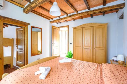 Ένα ή περισσότερα κρεβάτια σε δωμάτιο στο Agriturismo Pian di Fiume