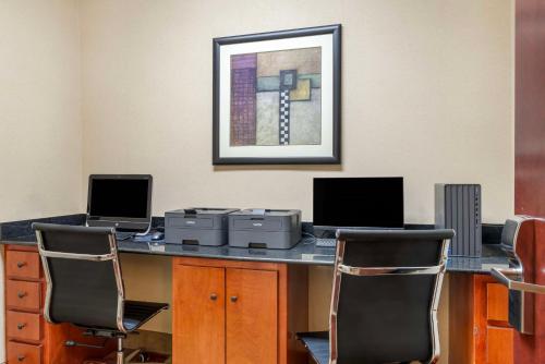 an office with two computers on a desk with two chairs at Best Western Plus Hopewell Inn in Hopewell