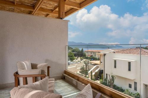 a balcony with a view of the ocean at Radisson Blu Hotel, Kas in Kas