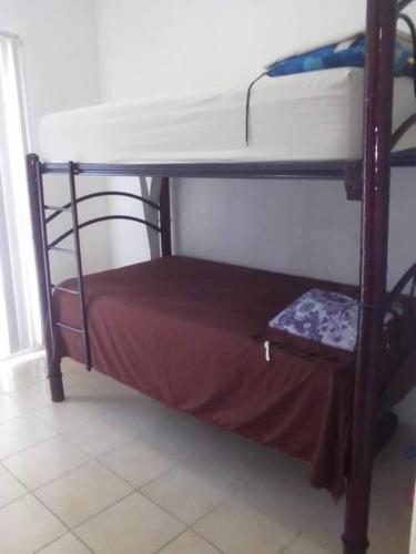 a small bunk bed in a room with at Departamento ACAPULCO PROMOCIÓN in Aguacatillo
