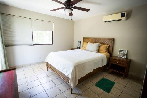 Ένα ή περισσότερα κρεβάτια σε δωμάτιο στο Condo Pacifico