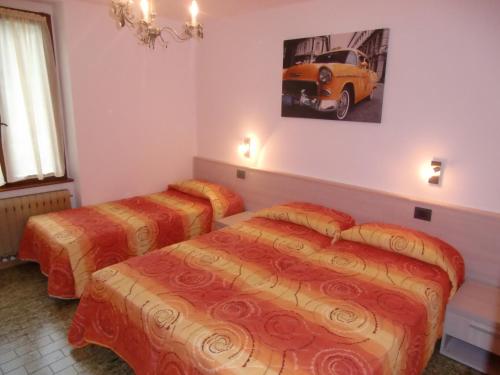 En eller flere senger på et rom på Casa Ambra