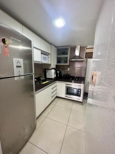 Η κουζίνα ή μικρή κουζίνα στο Apartamento a beira-mar com piscina