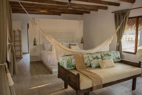 Giường trong phòng chung tại SAVANNA ORINOQUÍA LODGE