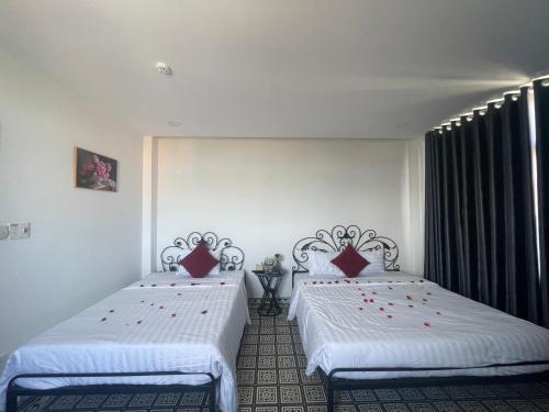 Ένα ή περισσότερα κρεβάτια σε δωμάτιο στο TIMES HOTEL