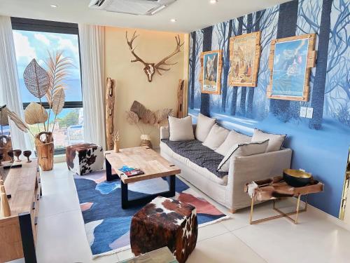 a living room with a couch and a table at Mullet Bay Suites - Your Luxury Stay Awaits in Cupecoy