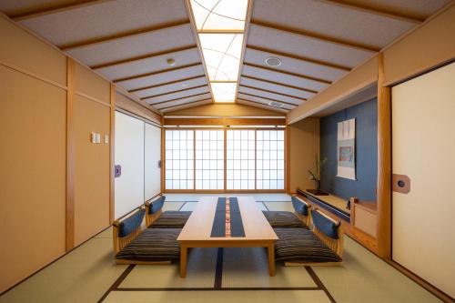 a conference room with a table and chairs at Kifuno Sato in Mimasaka