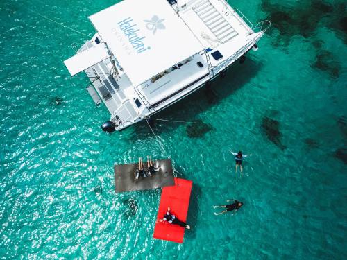 an overhead view of a boat in the water at Halekulani Okinawa in Onna