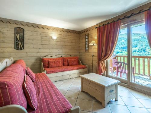 a bedroom with two beds and a balcony at Appartement Saint-Martin-de-Belleville, 4 pièces, 8 personnes - FR-1-461-26 in Saint-Martin-de-Belleville