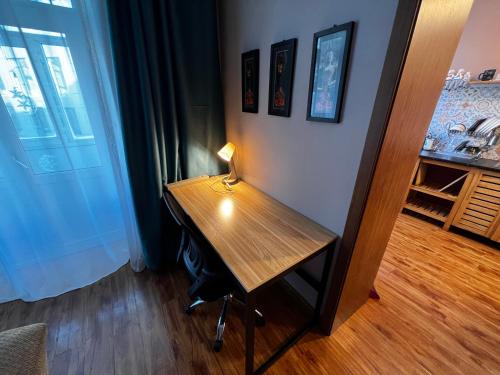 a desk with a lamp on it in a room at Location, locaton, location! in Ulaanbaatar