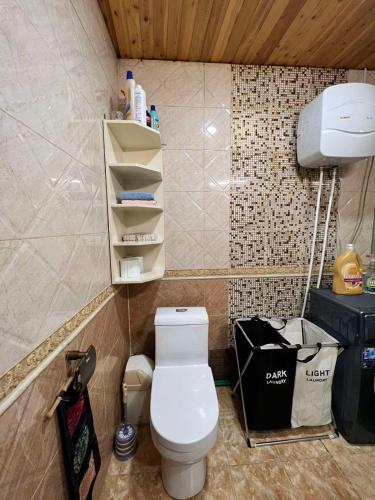a bathroom with a white toilet in a room at Location, locaton, location! in Ulaanbaatar