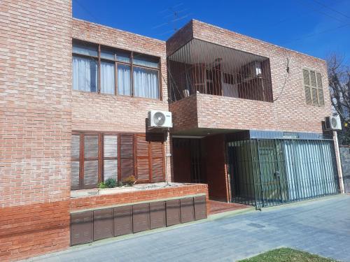 a brick building with a speaker on the side of it at CONSORCIO ARIZU in Mendoza