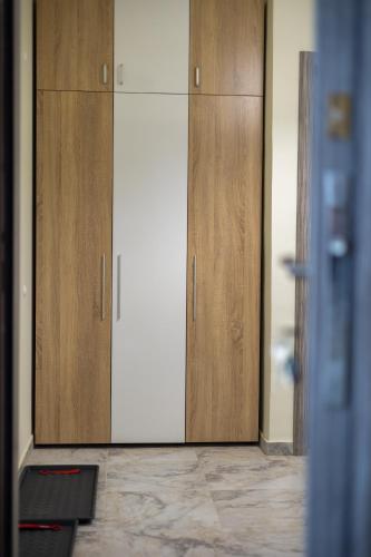 a pair of wooden cabinets in a room at Sunny Sofia Studio #1 in Sofia