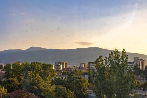 a view of a city with mountains in the background at Sunny Sofia Studio #1 in Sofia