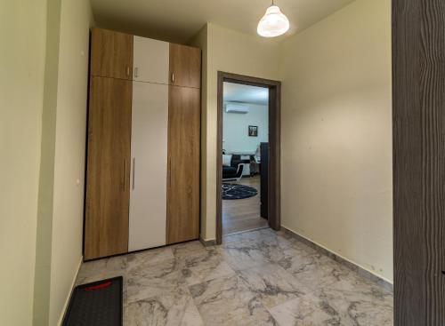 an empty hallway with a cabinet and a door at Sunny Sofia Studio #1 in Sofia