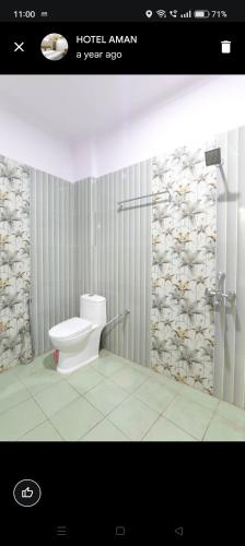 a picture of a bathroom with a toilet in it at HOTEL AMAN in Allahābād