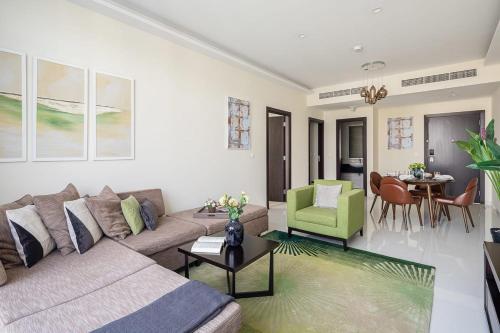 a living room with a couch and a table at Frank Porter - Damac Celestia in Dubai