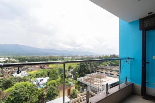 a balcony with a view of a city at Jasmine 3BHK by Wabi Sabi Stays with Private Balcony in Rishīkesh