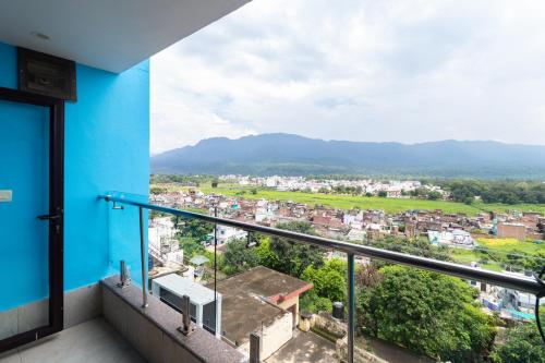 a balcony with a view of a city at Jasmine 3BHK by Wabi Sabi Stays with Private Balcony in Rishīkesh