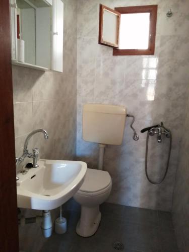 a bathroom with a toilet and a sink at Lito Rooms in Chania