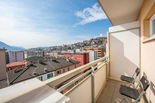 a balcony with a view of a city at Cosy Home Lugano Few Min From Lake - Happy Rentals in Lugano