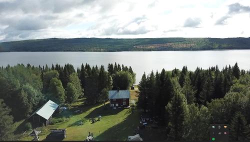 an aerial view of a house on an island in a lake at Simple charming Double-room close to nature in Hillsand