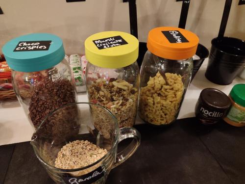 three containers of food sitting on a counter with food at Hotel la posada de Numancia in Garray