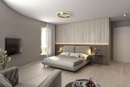 ein Wohnzimmer mit einem Bett und einem Sofa in der Unterkunft Hotel Rondo - Self-Check-in in Wil