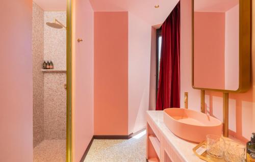 a bathroom with a sink and a shower at Play Levontin in Tel Aviv