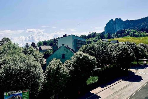 a group of trees in front of a building at [logement cosy] Belle vue, Reposant, Télétravail in Saint-Nizier-du-Moucherotte