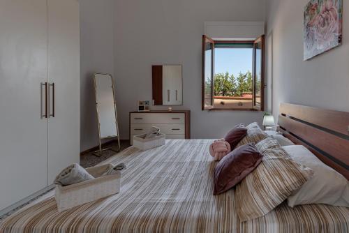Postel nebo postele na pokoji v ubytování Girasole Apartment