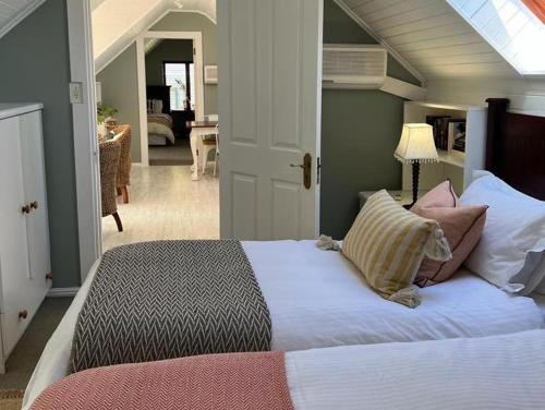 a bedroom with a large bed in a room at Dunvegan Lodge in Clovelly