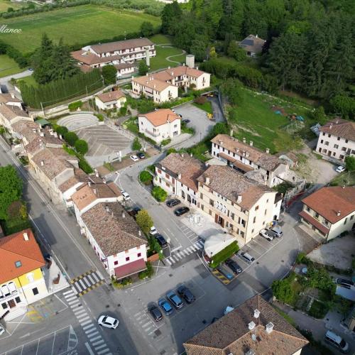 an aerial view of a small town with buildings at Locanda Alla Posta in Cavaso del Tomba