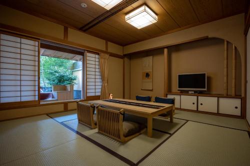 a room with a pool table and a window at Kifuno Sato in Mimasaka