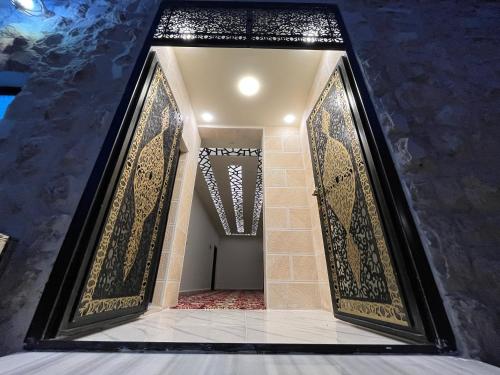 a hallway with a large mirror in a building at Mansi Residence in Wadi Musa