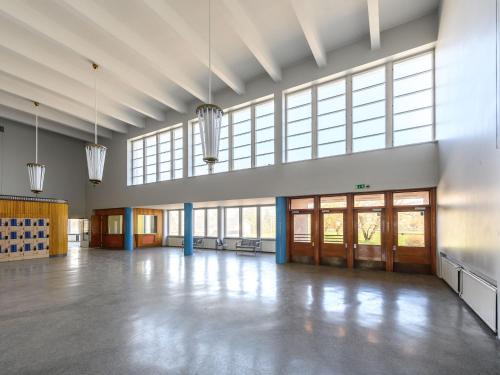 a large empty room with large windows and a large hall at Hangon Asema 14 in Hanko