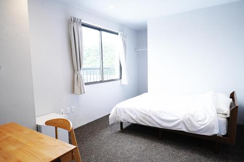 OiseSun CAFE & HOTELにあるベッド