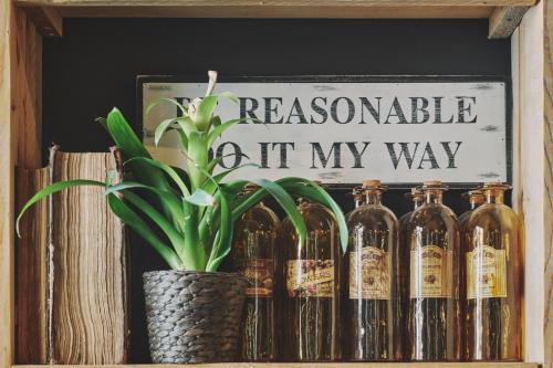 a shelf with bottles and a sign that reads resonance left my way at The Legacy by 2GO4 City Center in Brussels