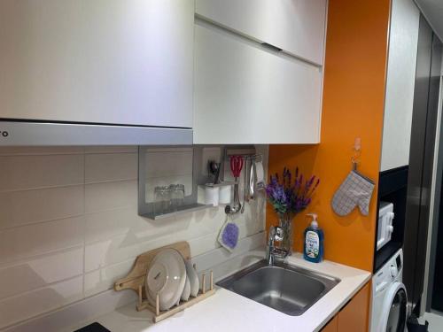 a kitchen with a sink and a counter top at For you House in Daegu