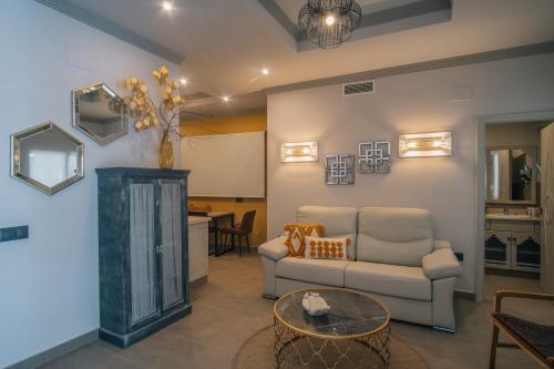 a living room with a couch and a table at Apartamentos Turísticos La Baílla in Rota