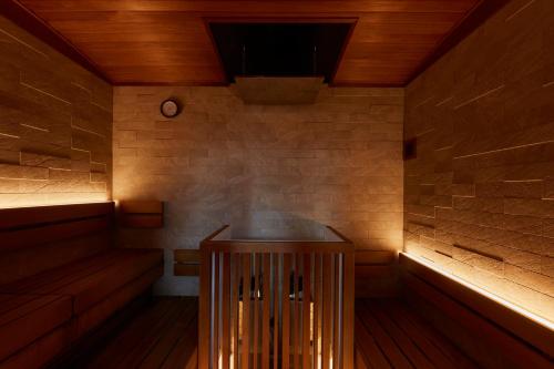 a sauna with wooden walls and wooden flooring at Azumi Setoda in Onomichi