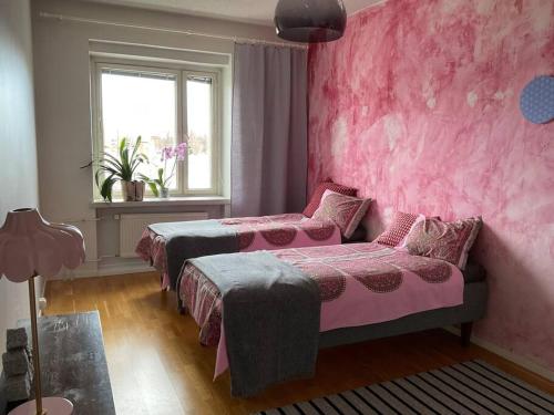 Postel nebo postele na pokoji v ubytování IloNam Asunto Kuopion ytimessä