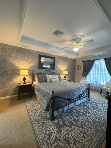 a bedroom with a large bed and a rug at Villa Nicol in Cape Coral