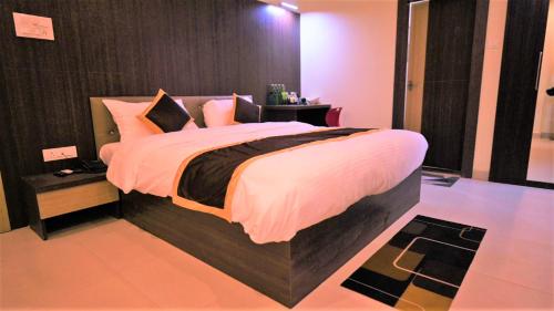 Katil atau katil-katil dalam bilik di Hotel Green Apple