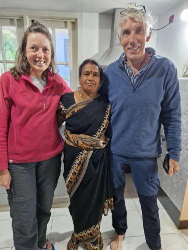 a man and two women standing next to each other at Narmada Holiday Home in Ooty