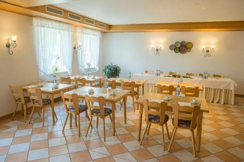 a large room with tables and chairs in it at Landgasthof Weberhans in Harburg