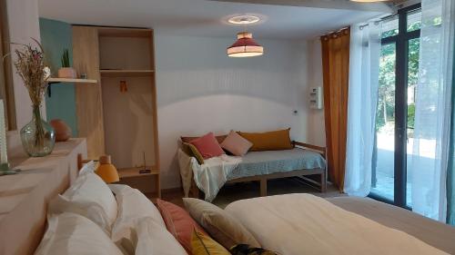 Postel nebo postele na pokoji v ubytování Ô Chambres d'Hôtes