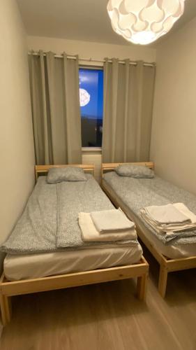 Ένα ή περισσότερα κρεβάτια σε δωμάτιο στο An apartment in which a room is rented out Jörfabakki 109 Reykjavík