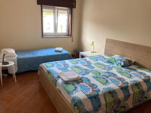 Ένα ή περισσότερα κρεβάτια σε δωμάτιο στο Terraço do Lima