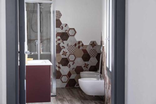 Ein Badezimmer in der Unterkunft Domo Orise Alloggio in pieno centro